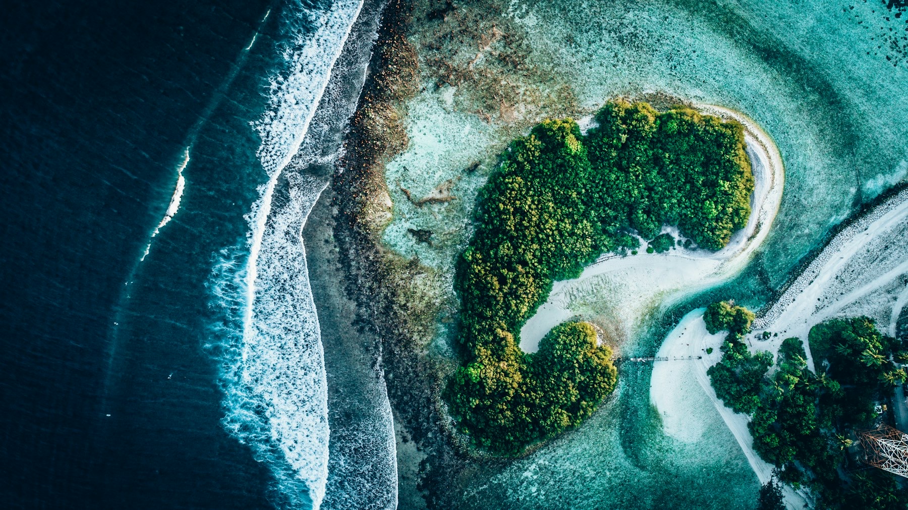 Aerial view of a pristine tropical island reef in the Riau Archipelago.